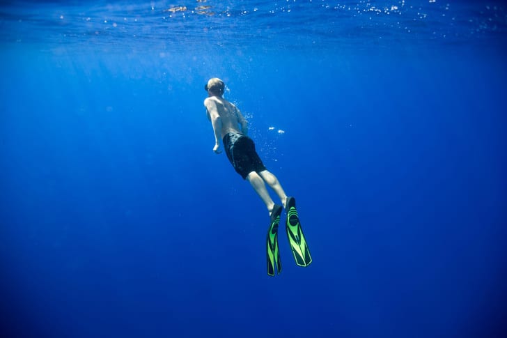 man free diving in the sea