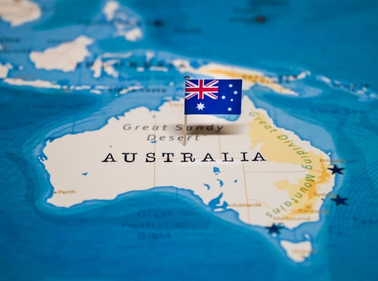 Australian flag pinned on Australia on a map
