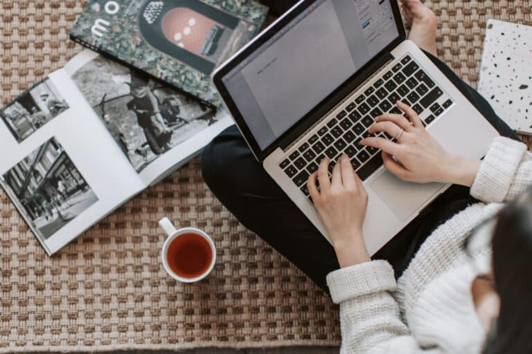 woman at laptop typing on keyboard